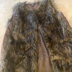 Faux fur vest. Pleather detail on sides. Size MED